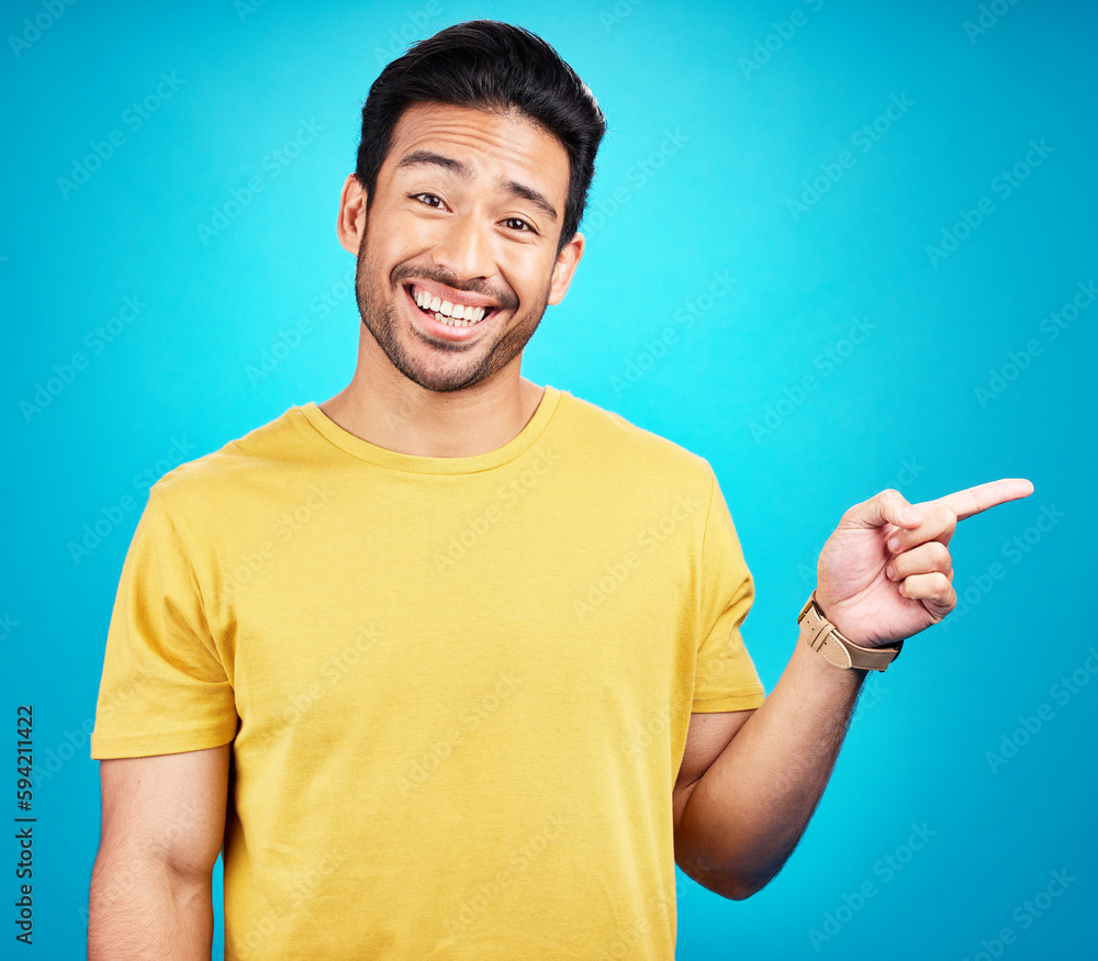 Man is pointing, advertising and promo with happiness and branding isolated on blue background. Opportunity, deal or announcement, marketing news and promotion ad with happy male person in portrait Man is pointing, advertising and promo with happiness and branding isolated on blue background. Opportunity, deal or announcement, marketing news and promotion ad with happy male person in portrait