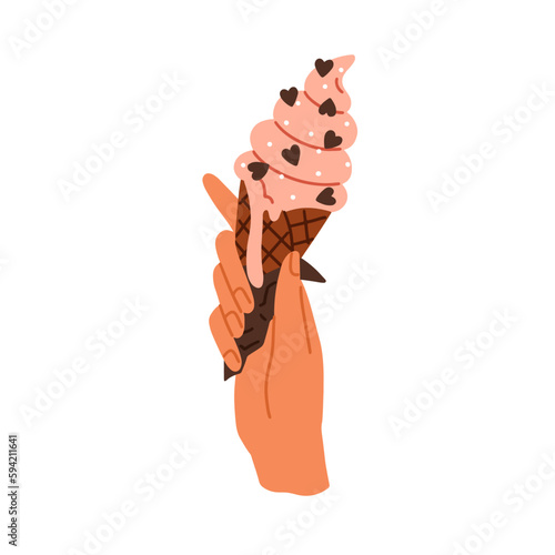 Hand holding ice-cream in cone. Icecream swirl with sprinkles, cold frozen su...