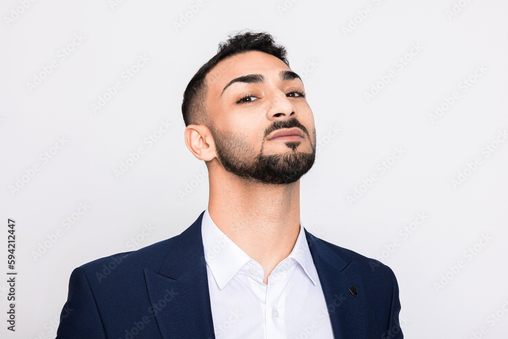 Buisness guy man standing over grey background in studio isolated looking at camera face head up wearing suit ellegant. Buisness guy man standing over grey background in studio isolated looking at camera face head up wearing suit ellegant.