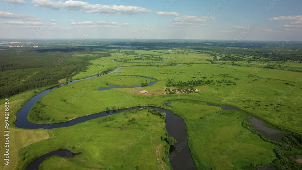 This drone video showcases the beauty of nature represented by a river and lake. The footage captures how beautifully both bodies of water fit into the surrounding landscape. This drone video showcases the beauty of nature represented by a river and lake. The footage captures how beautifully both bodies of water fit into the surrounding landscape.