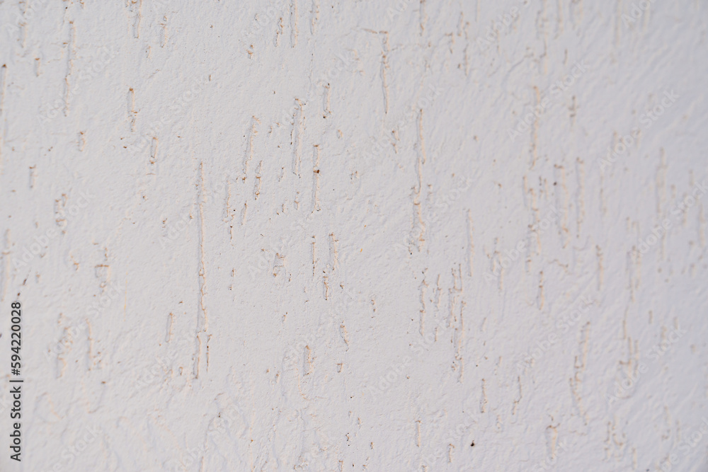 The surface of the wall with the texture of decorative plaster. The surface of the wall with the texture of decorative plaster.