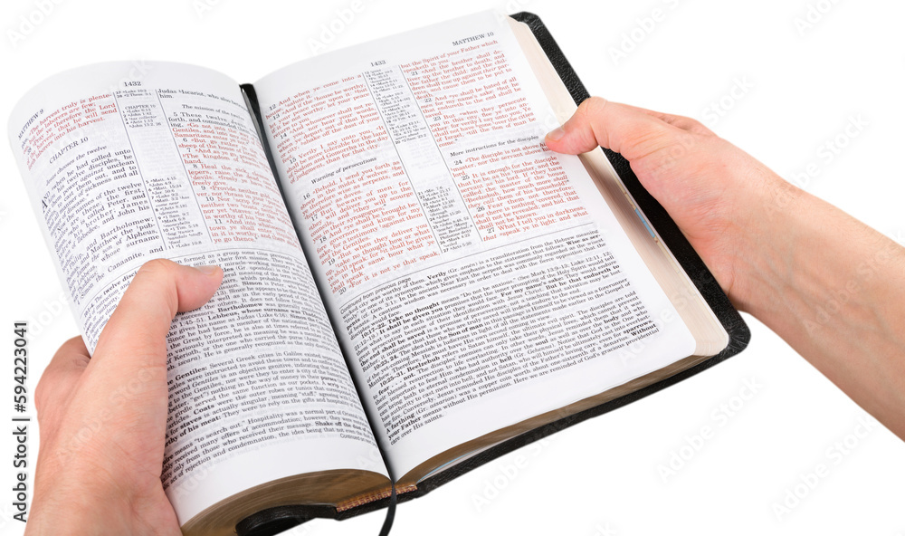 Fototapeta premium Closeup on Hands Holding an Open Bible