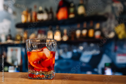 Cocktail Negroni with gin, campari martini rosso and orange. negroni cocktail at the bar photo