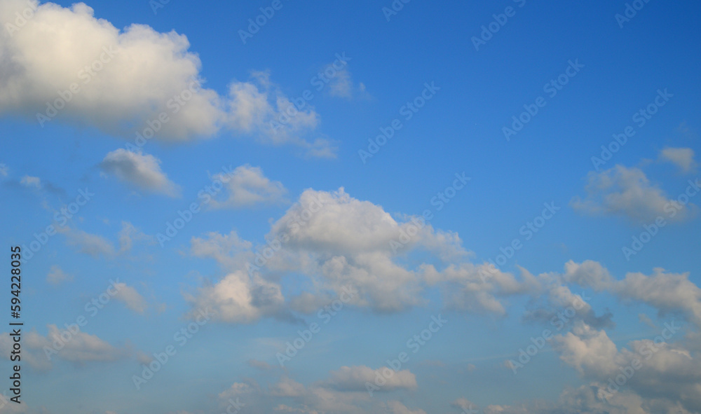 white fluffy clouds in the blue sky white fluffy clouds in the blue sky