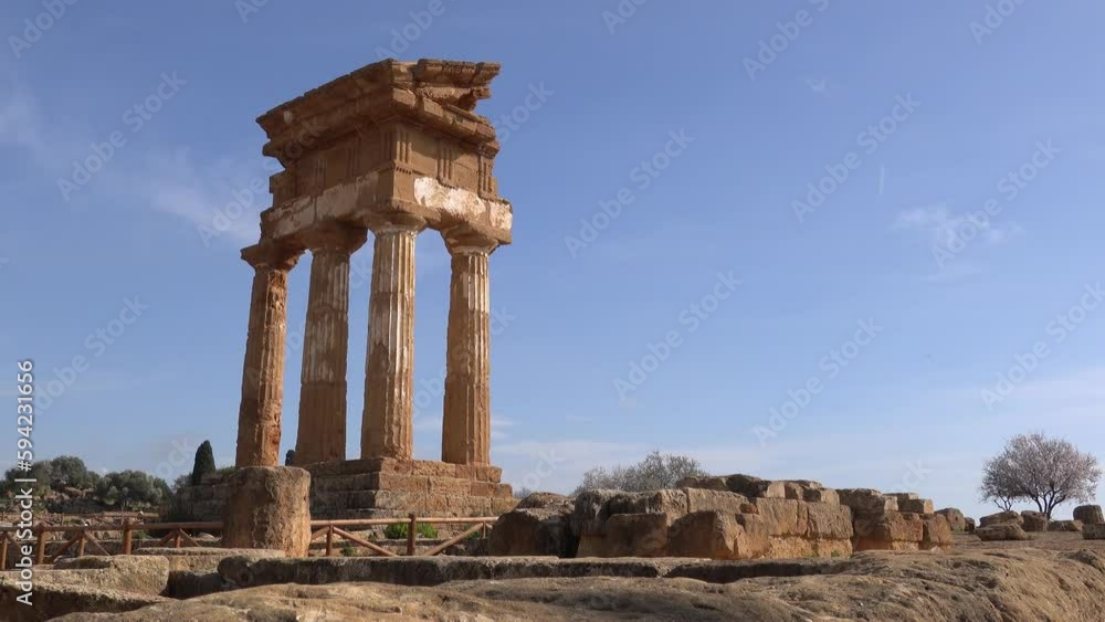 Panning with landscape of ancient Tempio dei Dioscuri or Tempio di Castore e Polluce temple in Valley of the Temples in Agrigento, Italy Panning with landscape of ancient Tempio dei Dioscuri or Tempio di Castore e Polluce temple in Valley of the Temples in Agrigento, Italy