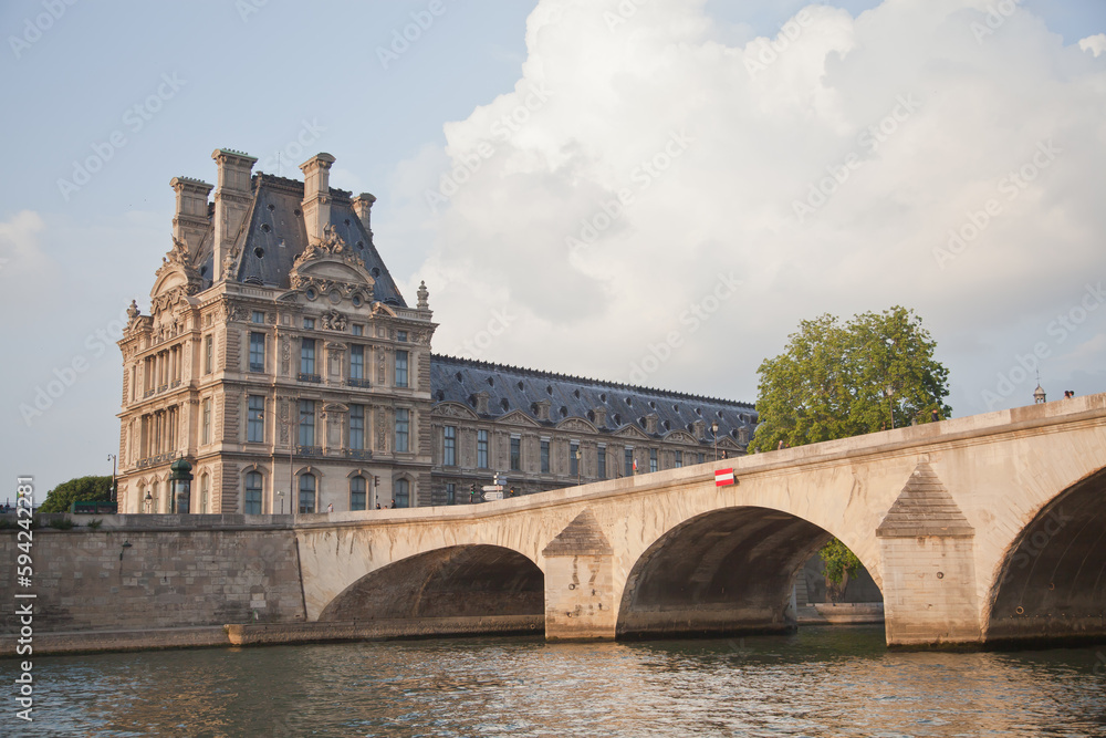 The Louvre across the River Seine in Paris France.