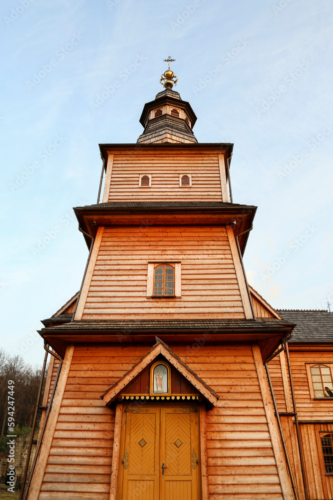 TRZEMESNIA, POLAND - MARCH 13, 2021: Historic wooden church in Trzemesnia, Poland. TRZEMESNIA, POLAND - MARCH 13, 2021: Historic wooden church in Trzemesnia, Poland.