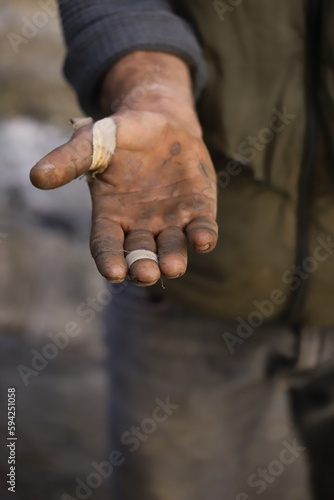 hands of a person with a cigarette