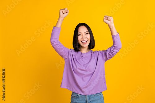 Tableau sur toile Photo of young korean woman scream wear trendy violet shirt fists up hooray cele