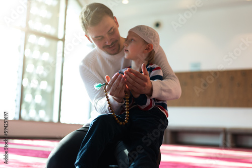 Islamic, community or people in praying with boy or kid for Gods support, spiritual peace during ramadan