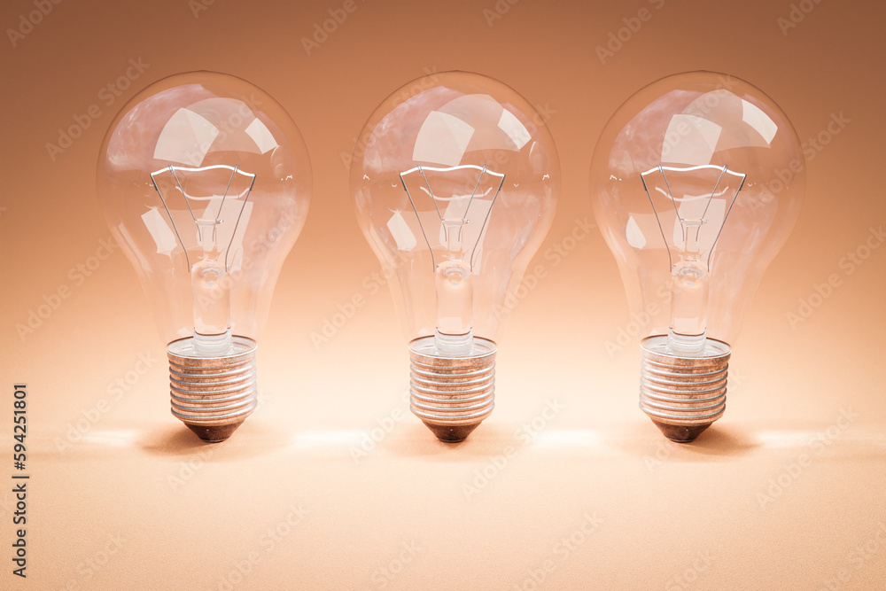 three retro style lightbulbs with glowing filament standing in a row on infinite colorful background; creativity design concept; 3D Illustration three retro style lightbulbs with glowing filament standing in a row on infinite colorful background; creativity design concept; 3D Illustration