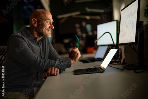 Investment advisor businessman sitting at office and using laptops and computer for work