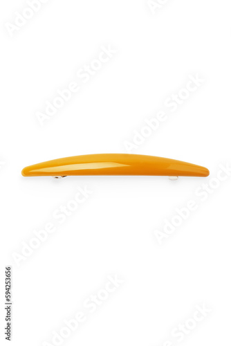 Detailed shot of a mustard colored oval hair clip. The hairpin is isolated on the white background. Vogue accessory for ladies and girls.