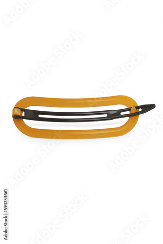 Detailed shot of a mustard colored oval hair clip. The hairpin is isolated on the white background. Vogue accessory for ladies and girls.