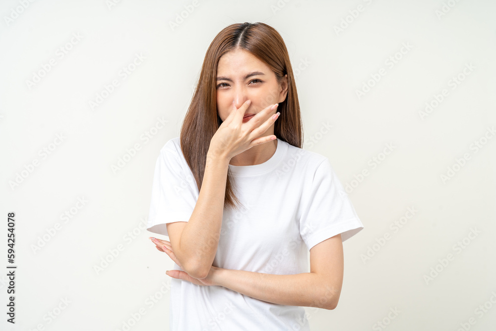 Bad smell stinks. Young beautiful asian woman pinching nose with disgust. Holding breath with fingers on nose Bad smell stinks. Young beautiful asian woman pinching nose with disgust. Holding breath with fingers on nose
