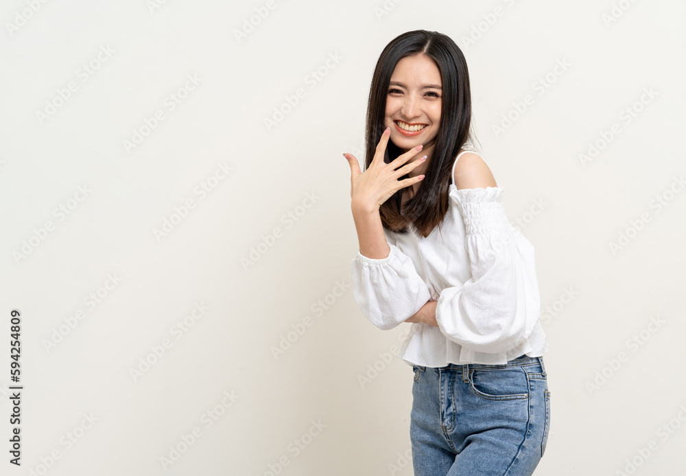 Beautiful smiling happy young asian woman age around 25 in white shirt. Charming female lady standing pose on isolated white background. Asian cute people looking camera confident with backdrop. Beautiful smiling happy young asian woman age around 25 in white shirt. Charming female lady standing pose on isolated white background. Asian cute people looking camera confident with backdrop.