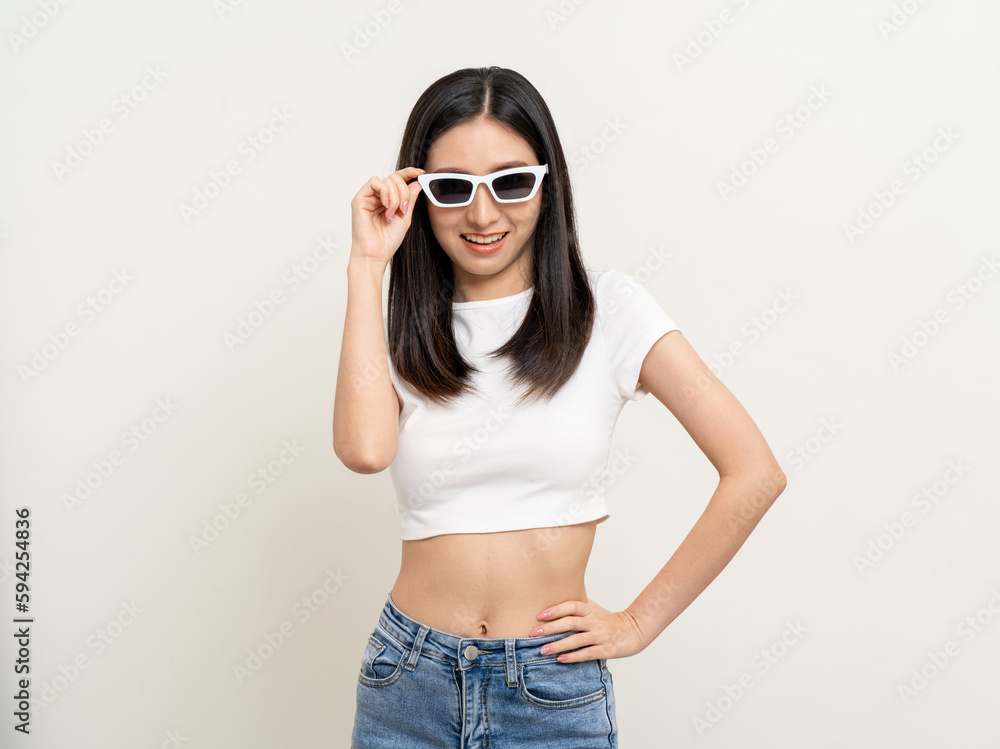 Attractive Beautiful asian woman standing and posing. Sexy female smiling happy fashion wearing sunglasses on isolated background. Attractive Beautiful asian woman standing and posing. Sexy female smiling happy fashion wearing sunglasses on isolated background.