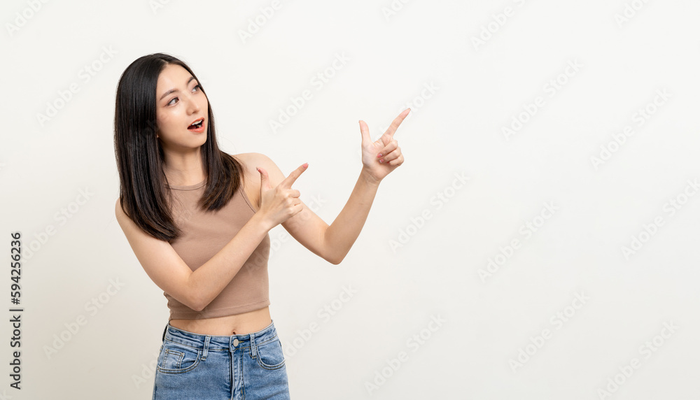 Happy beautiful young asian woman in brown shirt pointing finger to copy space. Smiling female lady with blank space. Asian cute Pretty people looking copy space text advertise Happy beautiful young asian woman in brown shirt pointing finger to copy space. Smiling female lady with blank space. Asian cute Pretty people looking copy space text advertise