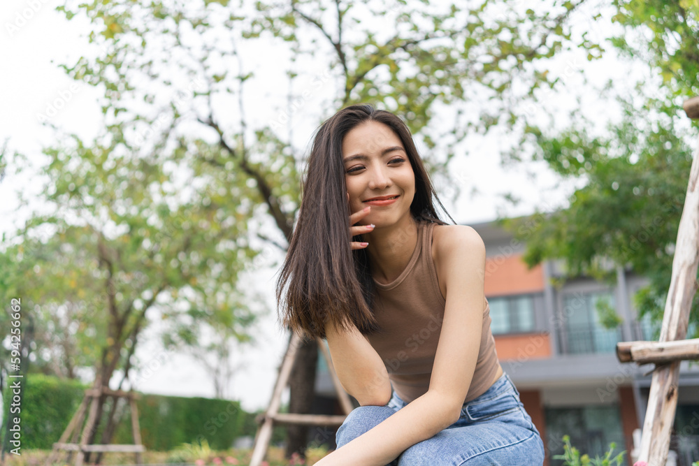 Happy feeling of Beautiful Young Woman smiling outdoor in sunlight. Pretty attractive face of female and beautiful smile. She is positive thinking and successful. Happy feeling of Beautiful Young Woman smiling outdoor in sunlight. Pretty attractive face of female and beautiful smile. She is positive thinking and successful.