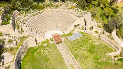 Aerial view of the Roman theater in the Pausilypon archaeological park. The theater is empty and nobody is in it. These ancient Roman ruins are located in Posillipo district in Naples, Campania, Italy photo