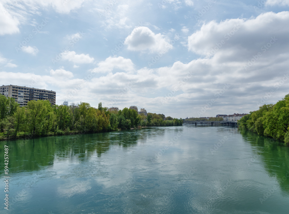 View from Woodrow Wilson bridge over Rhone river, in Lyon, France, looking south towards city center and Opera
