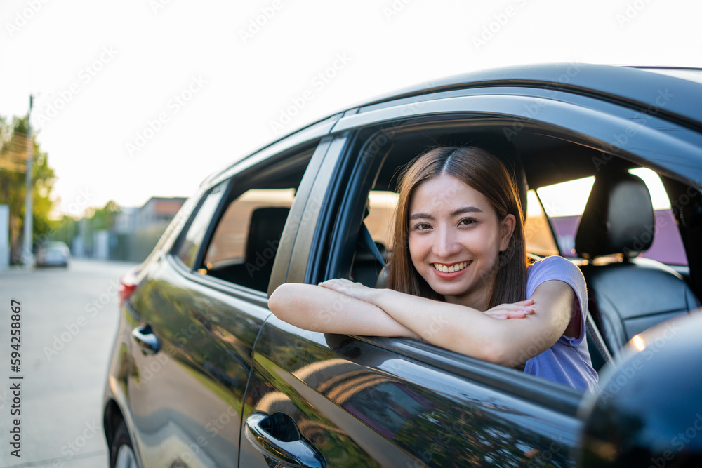 Young beautiful asian women getting new car. she very happy and excited. Smiling female driving vehicle on the road on a bright day. Young beautiful asian women getting new car. she very happy and excited. Smiling female driving vehicle on the road on a bright day.