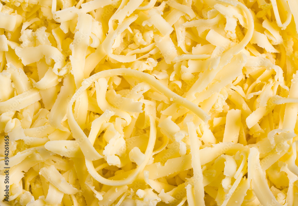 Grated pizza cheese (mozzarella) close up Grated pizza cheese (mozzarella) close up