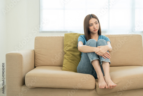 Depressed and Stressed asian woman on sofa. Crying sadness female alone in home problem in life. Unhappy asian woman headache Upset frustrated by problem love relationship feeling despair and anxiety Free Download Depressed and Stressed asian woman on sofa. Crying sadness female alone in home problem in life. Unhappy asian woman headache Upset frustrated by problem love relationship feeling despair and anxiety - GFXLoad