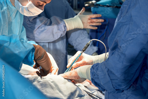 faces of surgeons in the operating room during the operation. Modern medicine, medical workers during a complex operation, modern medicine