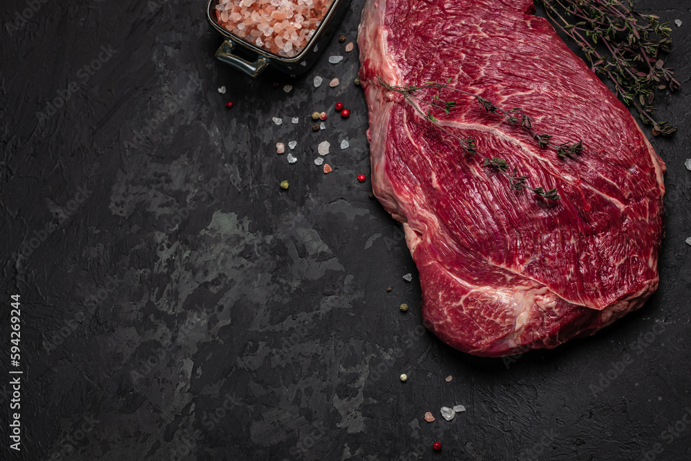 Raw veal meat, beef steak on black background, Whole piece of steaks ready to cook. banner, menu, recipe place for text, top view