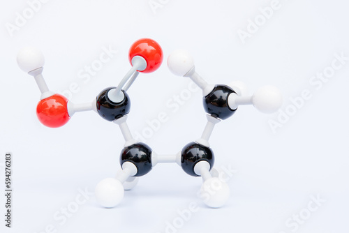 Butanoic acid is an oily colourless liquid with the chemical formula C4H8O2. It is a short chain saturated fatty acid found in the form of esters in animal fats and plant oils