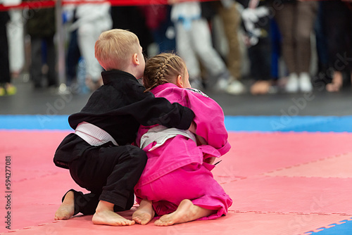 Brazilian jiu jitsufight between boy and girl © Marek