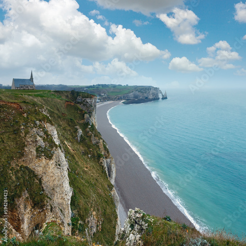 Etretat spring coast  France and church  Chapelle Notre-Dame-de-la-Garde  build in 1856  on rocks top. View from the top.