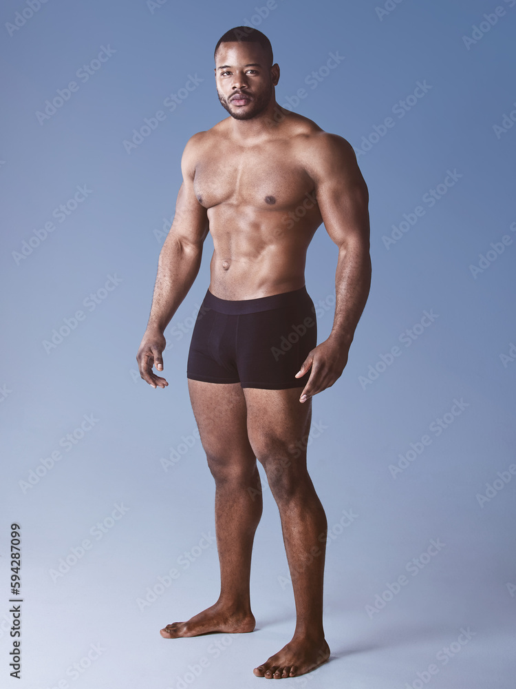 Keep the mind strong and the body stronger. Full length shot of a handsome young man posing shirtless in the studio.