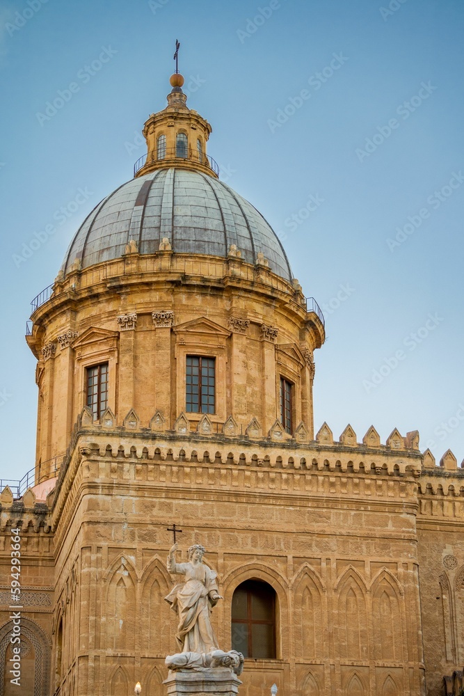 Vertical shot of Palermo Cathedral against the blue sky