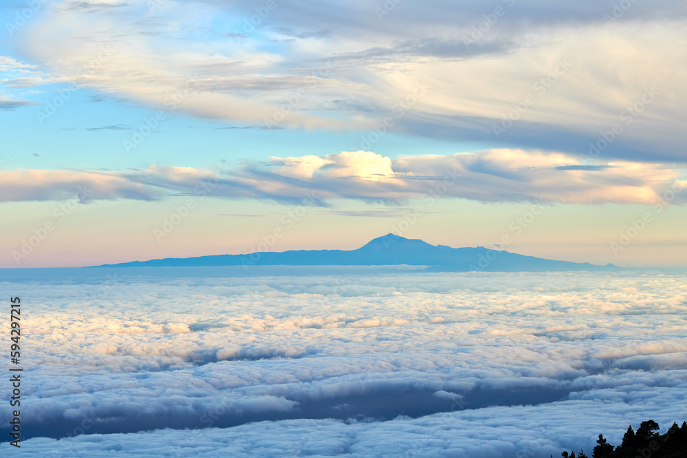 Tenerife is the largest of Spains Canary Islands, off West Africa. Its dominated by Mt. Teide, a dormant volcano that is Spains tallest peak. Tenerife may be best known for its Carnaval de Santa Cruz Tenerife is the largest of Spains Canary Islands, off West Africa. Its dominated by Mt. Teide, a dormant volcano that is Spains tallest peak. Tenerife may be best known for its Carnaval de Santa Cruz