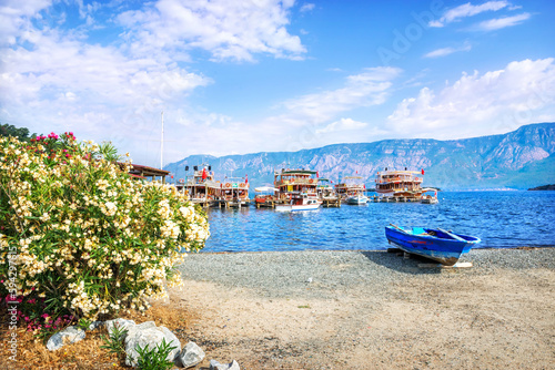 Fototapeta Naklejka Na Ścianę i Meble -  Pleasure boats for tourists at the Chamlik pier on the way to the island of Cleopatra, Aegean Sea, Marmaris, Turkey