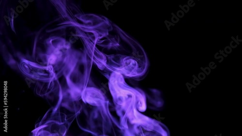 Real purple smoke from incense on black background, smoke overlay in slow motion. Close up.