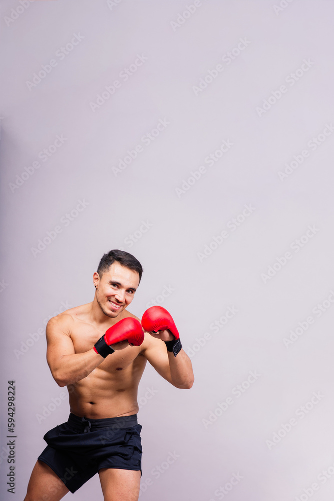 Boxing gloves, man training in sports fight, challenge or mma competition on studio background. Boxing gloves, man training in sports fight, challenge or mma competition on studio background.