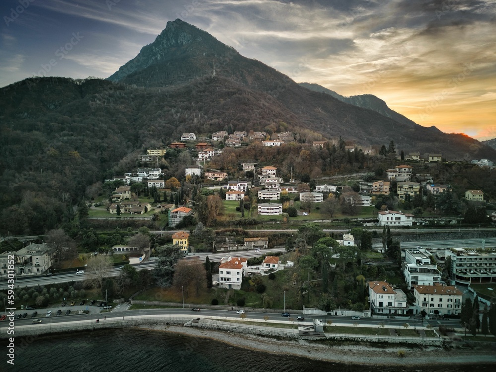 Landscape of a town surrounded by mountains in the evening in Italy