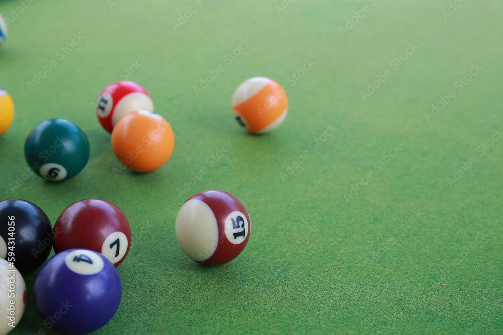 Billiard balls on a green billiard table. Billiard balls on a green billiard table.