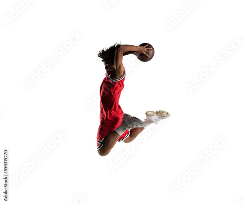 Isolated basketball  player jumping to make a basket © alphaspirit