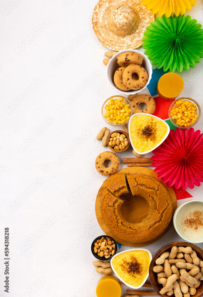 Festa Junina Summer Festival Carnival concept. Brazilian straw hat, popcorn, peanuts and Corn Cake on White Wooden Background Festa Junina Summer Festival Carnival concept. Brazilian straw hat, popcorn, peanuts and Corn Cake on White Wooden Background