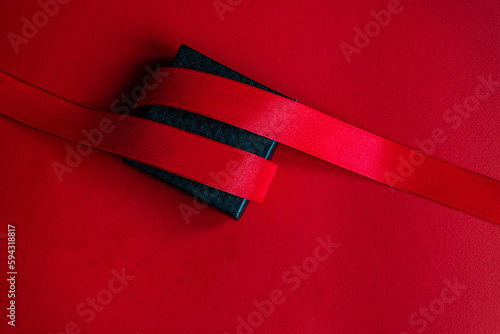 Black gift box with red ribbon