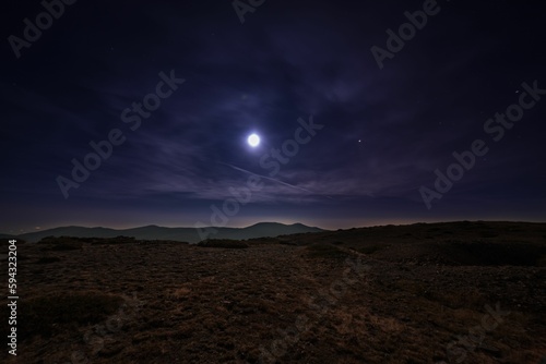 Beautiful night over a highland with mountain range