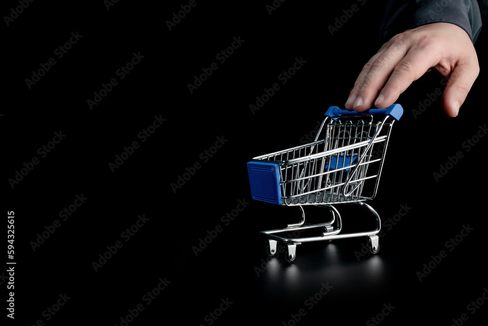 Empty shopping cart on a black background.