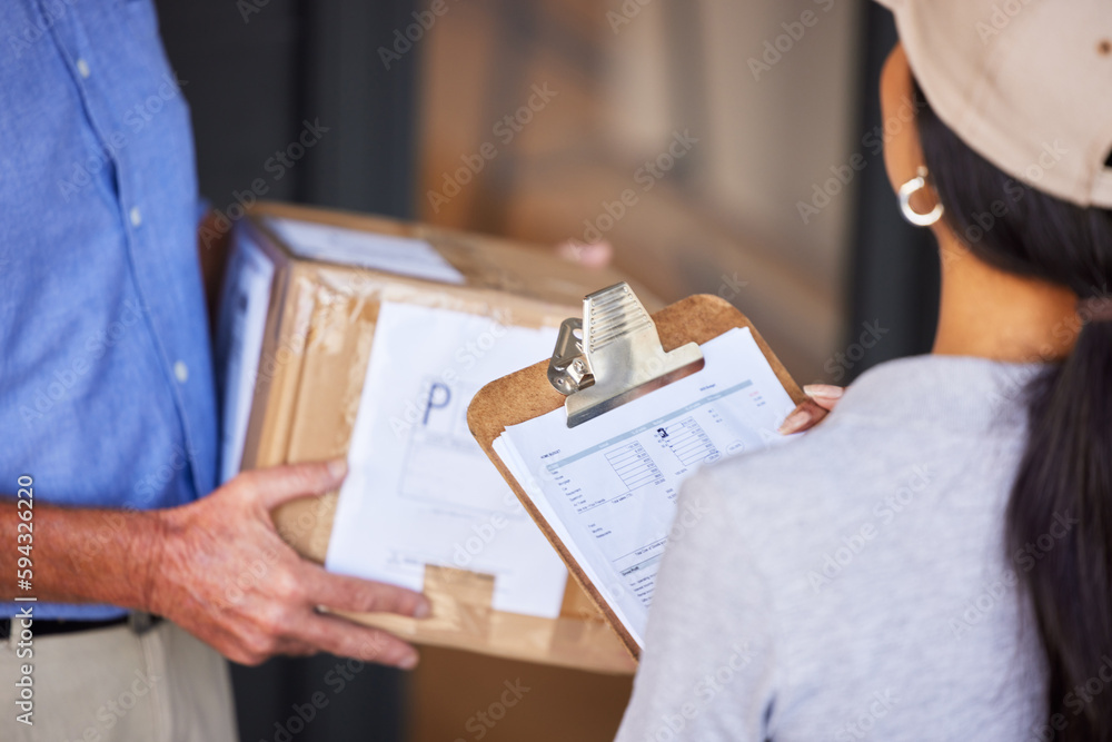 Your package has arrived. High angle shot of an unrecognizable man taking delivery of a package from a female courier.