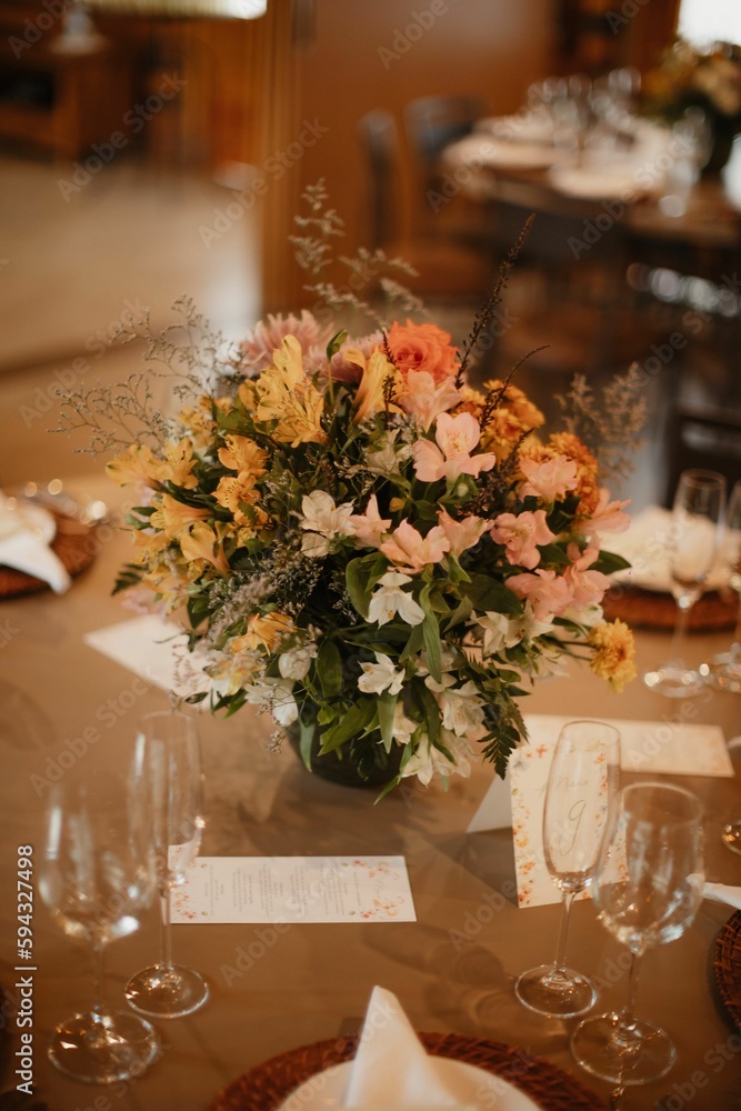 Vertical shot of floral decorations during a wedding celebration ceremony