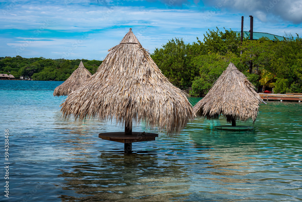 Idyllic transparent water beach in the caribbean sea in a sunny day, Roatan. Idyllic transparent water beach in the caribbean sea in a sunny day, Roatan.