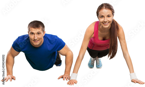 Young couple training together on white background